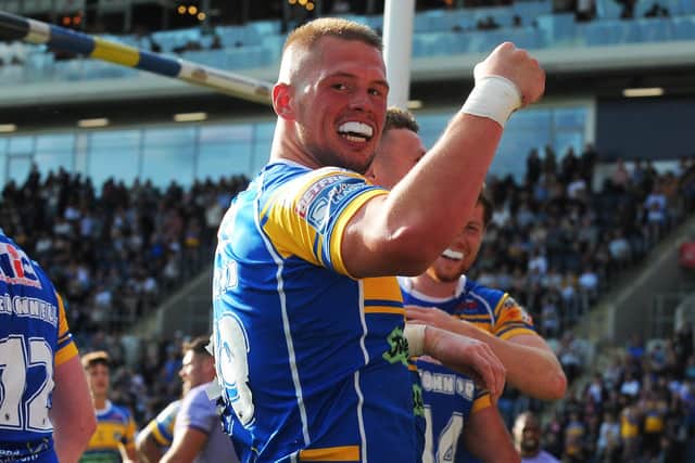 Tom Holroyd celebrates his try against Warrington Wolves. Picture by Steve Riding.