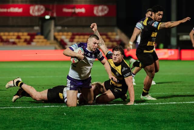 Wakefield Trinity's Max Jowitt is tackled by Jack Martin and Denive Balmforth of York. Picture by Alex Whitehead/SWpix.com.
