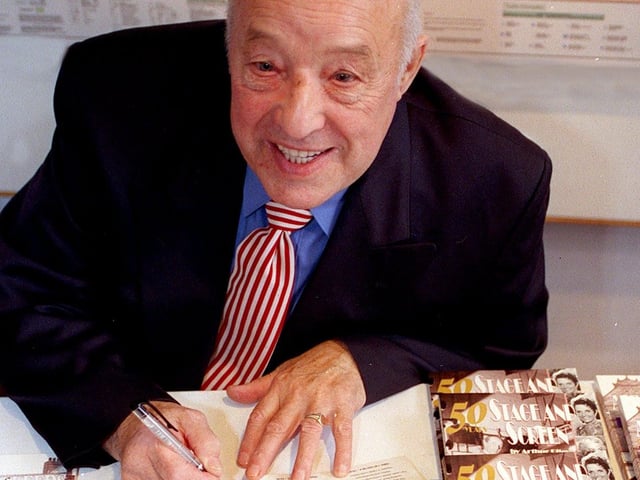 Arthur Riley signs copies of his new book"50 Years of Stage and Screen", at city centre tourist information centre Gateway in November 1999.