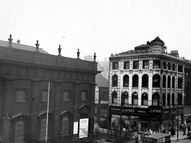 An elevated view of Boar Lane in March 1956, showing Holy Trinity Church on the left and J. Jones, furriers, on the right. This building has the name 'Trinity House' on a plaque on the roof corner; whether the building originally had any connection to Holy Trinity Church, or was just so named because it was next to it, is unclear at present.