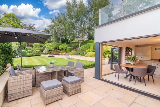 The thoughtfully-designed garden to the rear includes an area with composite decking. There are two driveways leading to both a double and a single integral garage