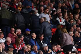 SEEN ENOUGH: Sheffield United fans head for the exits with their team 6-0 down in Sunday's Premier League hosting of Newcastle United which ended in an 8-0 hiding.
Photo by DARREN STAPLES/AFP via Getty Images.