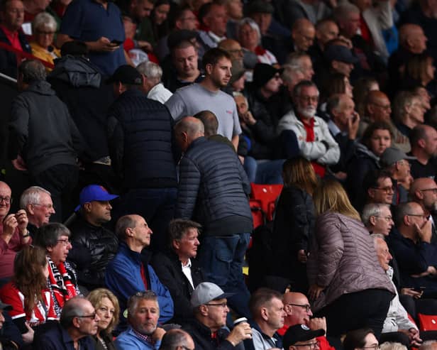 SEEN ENOUGH: Sheffield United fans head for the exits with their team 6-0 down in Sunday's Premier League hosting of Newcastle United which ended in an 8-0 hiding.
Photo by DARREN STAPLES/AFP via Getty Images.