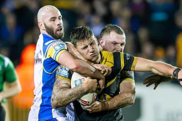 Castleford Tigers' Alex Mellor is tackled by Matt Frawley and Cameron Smith. Leeds Rhinos defended superbly under pressure in the first half of their 26-6 win at the Jungle. Picture by Allan McKenzie/SWpix.com.