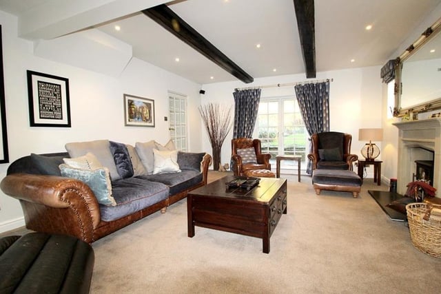 The beamed sitting room within the cottage style property.