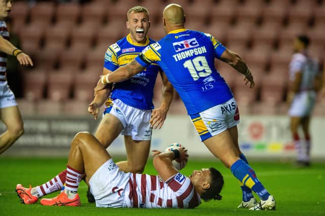 Jarrod O'Connor celebrates with then Rhinos teammate Bodene Thompson after scoring in last season's semi-final win at Wigan. Picture by Bruce Rollinson.