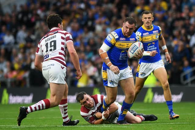 Cameron Smith breaks a tackle during Rhinos' win over Wigan last month.  Picture by Jonathan Gawthorpe.