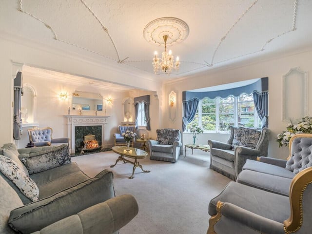 The main lounge, with its graceful bay frontage and generous dimensions, provides a perfect space for relaxation or entertaining.