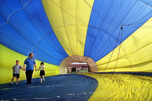 Stephen Englefield, headteacher at Brownhill Primary, is pictured with pupils Ryan Holmes and Sasha Skey inside a hot air balloon as it is inflated in the school grounds in May 1998.