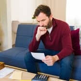 If you've built up debt, please don't ignore bills or letters, and remember that there is support out there for you. Photo: StockAdobe