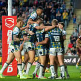 Rhinos celebrate the seventh of their nine tries against Huddersfield, scored by Rhyse Martin. Picture by Bruce Rollinson.
