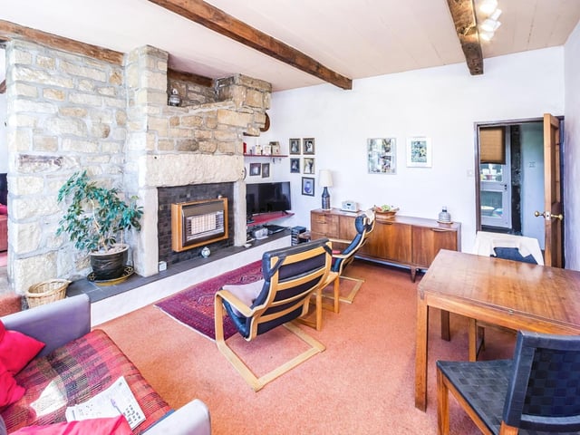 The stone fire surround is a focal point of this second ground floor room.
