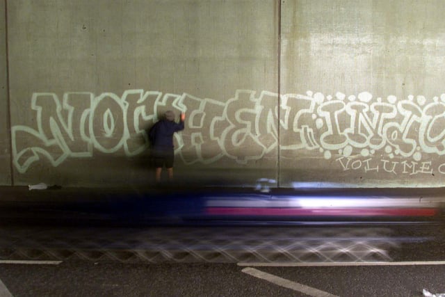 Graffitti artist 'Moose' demonstartes his skills in one of the many tunnels in Leeds. Rather than painting on the slogans, Moose simply wiped off dirt which accumulated from the passing traffic.