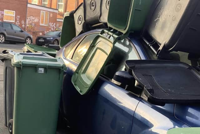 The car was blocking Back Welton Place when it was buried in the bins.