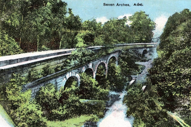 The seven arches aqueduct carried water from the Eccup Reservoir (built 1837) to the city centre. Underground pipes and tunnels carried the water for most of the six mile route, however at Adel it must cross the Adel Beck, for this reason the aqueduct was built. A postcard from April 1906.