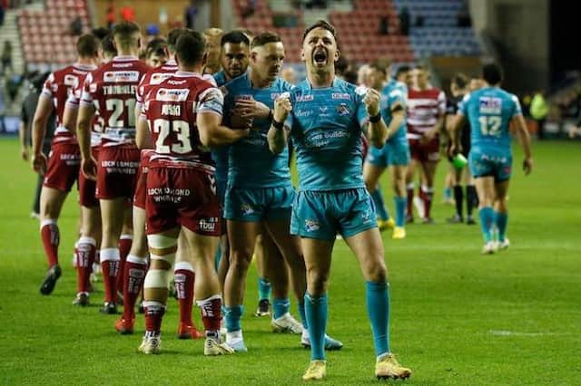 Richie Myler leads the celebrations after Rhinos' win at Wigan in June. Picture by Ed Sykes/SWpix.com.