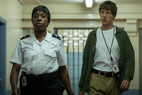 Officer Stephens (Ronke Adekoluejo) and Dan (Josh Finan) make their way through prison in the new BBC drama Waiting for the Out (Picture: BBC/Sister Pictures/Kerry Spicer)