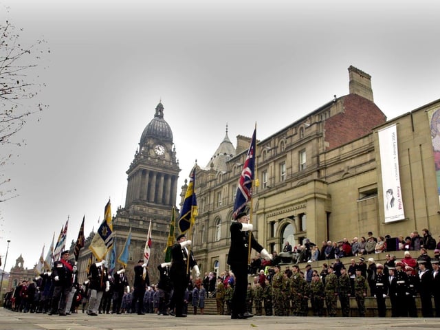 Standard bearers arrive at the war memorial at Victoria Gardens for the Remembrance Sunday Service in November 2003.