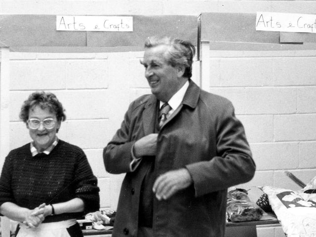 MP for East Leeds, Denis Healey is pictured as he attends the Spring and Summer Fayre at the Denis Healey Centre in Foundry Mill Street in September 1989. He is reaching for his wallet as he is about to make a purchase from the Arts and Craft Stall. At the time he was on his way to his surgery but dropped in to support the Fayre. The fund raising event collected £70 with over a dozen stalls, games, a treasure hunt, raffles and refreshments. Denis Healey remarked that the Fayre was a fine example of community spirit.