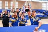 Leeds Rhinos' Ewan Clibbens, Jodie Boyd-Ward and Tom Halliwell lift the Betfred Wheelchair Challenge Cup in 2022, following victory against Catalans Dragons in the final. Picture by Will Palmer/SWpix.com.