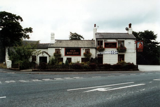 The Old Red Lion on York Road at Whinmoor. The colourfully painted pub sign depicting a lion's head hangs on the corner of the building. It was the first Inn after the toll bar on the turnpike at Whinmoor, stage coaches used the Old Red Lion on route to and from York. It closed in 2021.