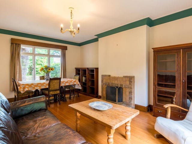 The house opens up to a beautiful oak-panelled entrance hall, with a warm and inviting living room on the left, spanning the full length of the house.