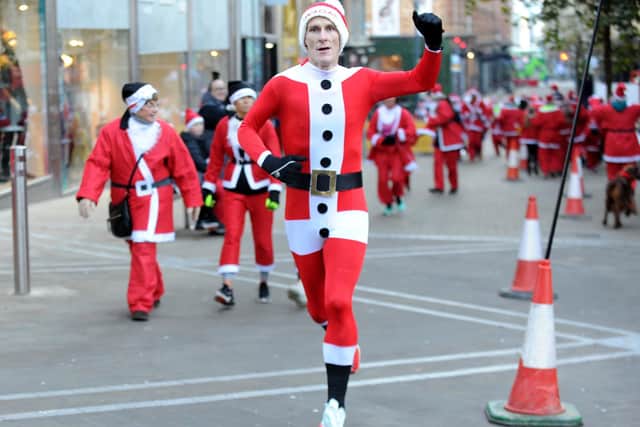 Molly's dad Richard Hayes finished first in the Big Leeds Santa Dash out of the 500 plus runners taking part. Photo: Steve Riding