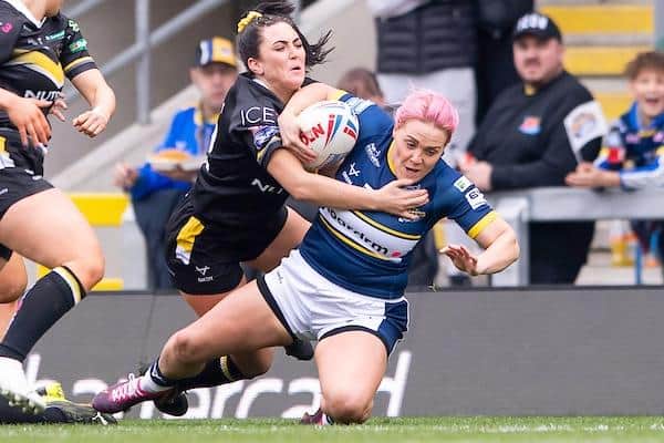 Leeds debutant Amy Hardcastle is tackled by York's Ellie Hendry. Picture by Allan McKenzie/SWpix.com.