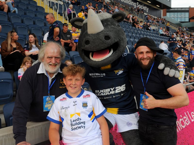 George Hayter, aged 10, his granddad Richard and dad Ed meet Ronnie Rhino.