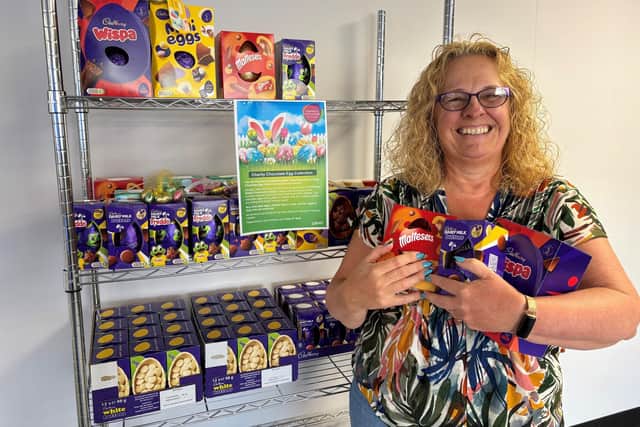 Alison Young collecting up donated Easter eggs at Lubrizol