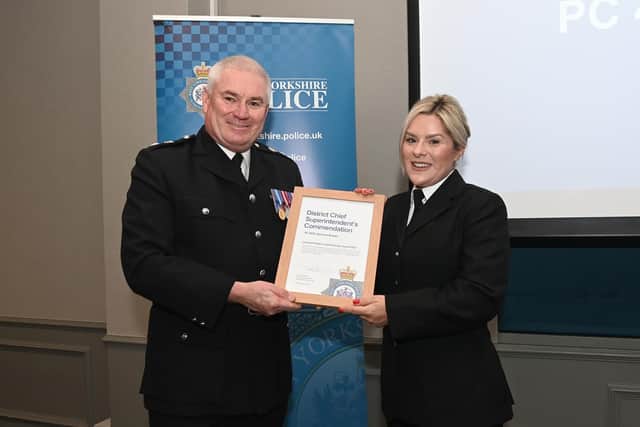 PC Gemma Brown receiving the Solving Problems with Partners Award from Chief Superintendent Steve Dodds. Photo: West Yorkshire Police