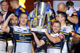 Leeds Rhinos' Danny McGuire and Rob Burrow lift the Super League trophy after the 2017 Grand Final win against Castleford Tigers.