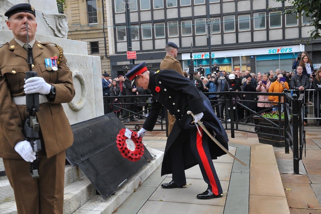 After the service, the Lord Mayor and civic representatives took to the steps of the Town Hall where a salute and march took place. Pictured: The Lord Lieutenant West Yorkshire Ed Anderson lays a wreath.