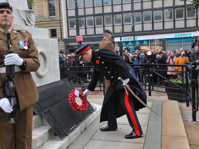 After the service, the Lord Mayor and civic representatives took to the steps of the Town Hall where a salute and march took place. Pictured: The Lord Lieutenant West Yorkshire Ed Anderson lays a wreath.