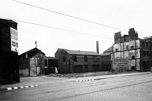 The north side of Wellington Street in July 1943. Cropper Gate is facing and Grove Street runs parallel behind. Derelict buildings and advertising sign for Bovril can be seen.