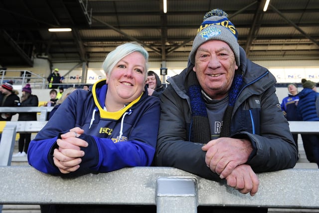 Two fans in the South Stand before Rhinos' 41-22 defeat of Wakefield Trinity on Boxing Day.