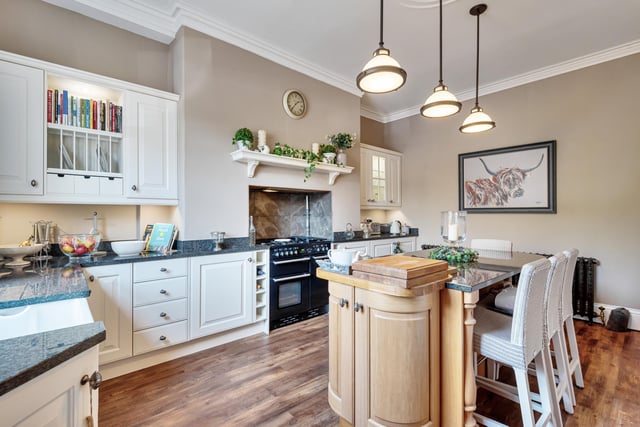 Up on the ground floor is a modern kitchen complete with fitted appliances, high ceilings, period coving and large cast iron radiators.