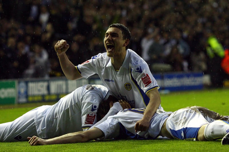 Robert Snodgrass of Leeds United celebrates with goalscorer Luciano Becchio during the Coca Cola League One play-off semi-final second leg match between Leeds United and Millwall at Elland Road (Photo by Alex Livesey/Getty Images)