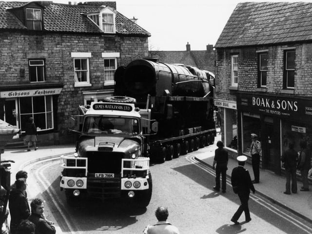 April 1980 and a trailer with its unusual load manoeuvres through Pickering's narrow streets. The rusting Taw Valley, an ex Southern Railway engine rescued from a scrap yard at Barry, South Wales, was on the last stage of a 25mph journey by road to Pickering to join the rolling stock of the North Yorkshire Moors railway. Bert Hitchen brought 100 tonne steam locomotive for his wife Elizabeth as a birthday present. The  copuple would spend their weekends for the next four years helping to restore the engine at a cost of about £30,000.