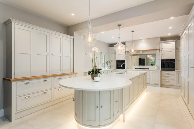 One of the most notable rooms in the house is the hand crafted kitchen-dining room, fitted by Ryburn Valley Bespoke Furniture in a traditional shaker style, painted in Farrow and Ball with quartz Angelo white work surfaces and a central island unit.