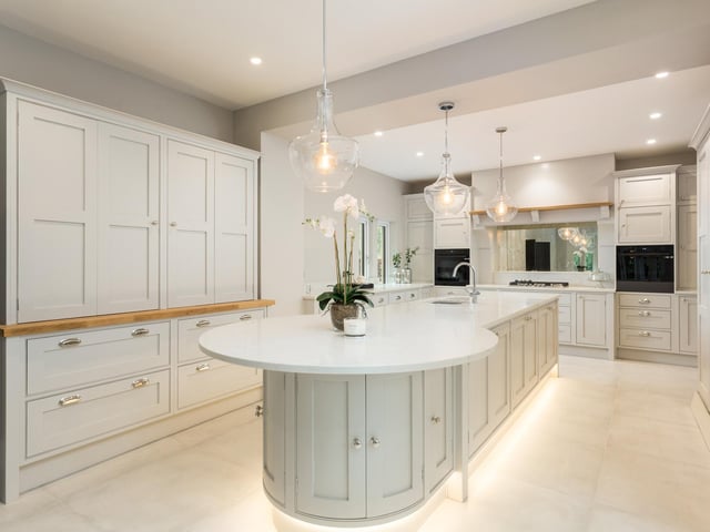 One of the most notable rooms in the house is the hand crafted kitchen-dining room, fitted by Ryburn Valley Bespoke Furniture in a traditional shaker style, painted in Farrow and Ball with quartz Angelo white work surfaces and a central island unit.