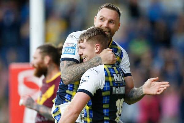James McDonnell is congratulated by Blake Austin after scoring for Rhinos against Huddersfield last month. Picture by Ed Sykes/SWpix.com.