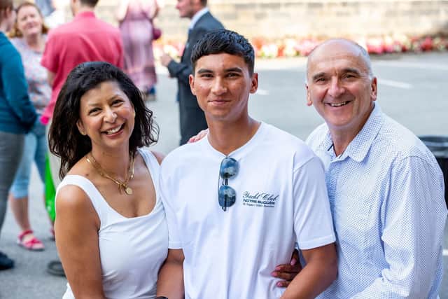 England U19 Cricketer Alexander Wade celebrates getting into Durham University with his parents.