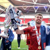Carlisle United's Alfie McCalmont (left) and Carlisle United's Jack Robinson celebrate with the trophy after being promoted to the Sky Bet League One following the Sky Bet League Two play-off final (Pic: Nigel French/PA Wire)