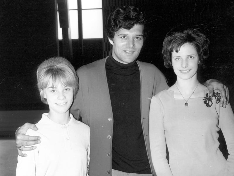 Pop singer Eden Kane is photographed with two girls, making a personal appearance at the Silver Blades skating rink in May 1965. Born Richard Sarstedt he had a number 1 hit with Well I Ask You and a further top ten hit with Boys Cry in 1964.