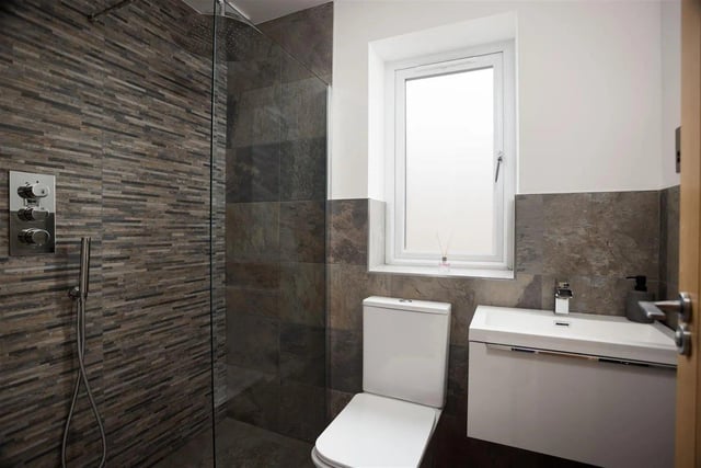 The house bathroom is fully tiled with stunning feature wall and hosts a free standing bath, toilet, sink and walk in shower.