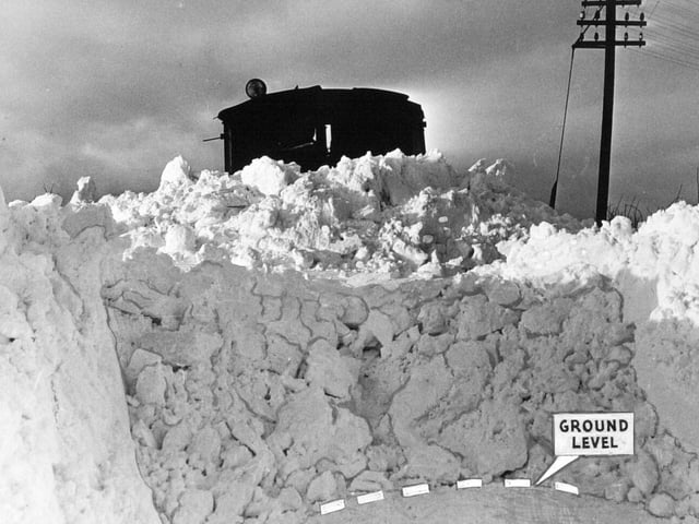 A giant snowplough breaks through the road to Thixendale in January 1960.