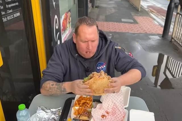 Danny Malin eating at My Spice & Grill on Kirkstall Road in Burley. Photo: Youtube/Rate My Takeaway