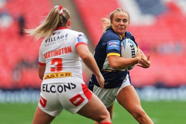 Lucy Murray, of Rhinos, runs at St Helens' Eboni Partington in the Challenge Cup final. Picture by Will Palmer/SWpix.com.