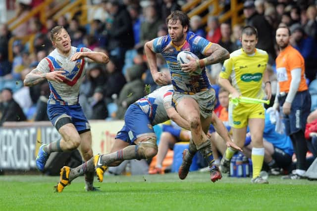 Mitch Achurch on the attack for Rhinos in the 2015 Boxing Day game. Picture by Steve Riding.